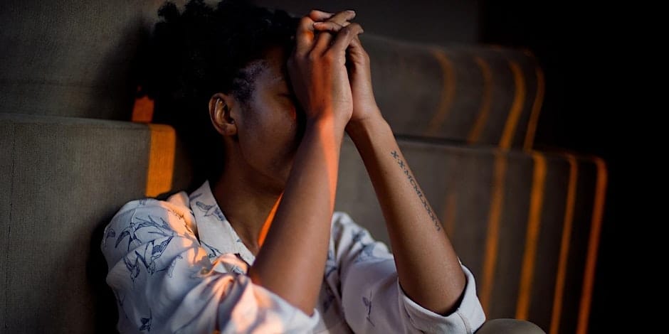 a black woman experiencing grief and loss