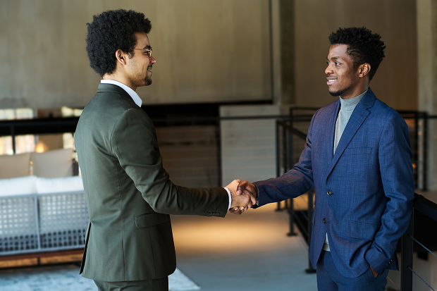 two men shaking hands in agreement